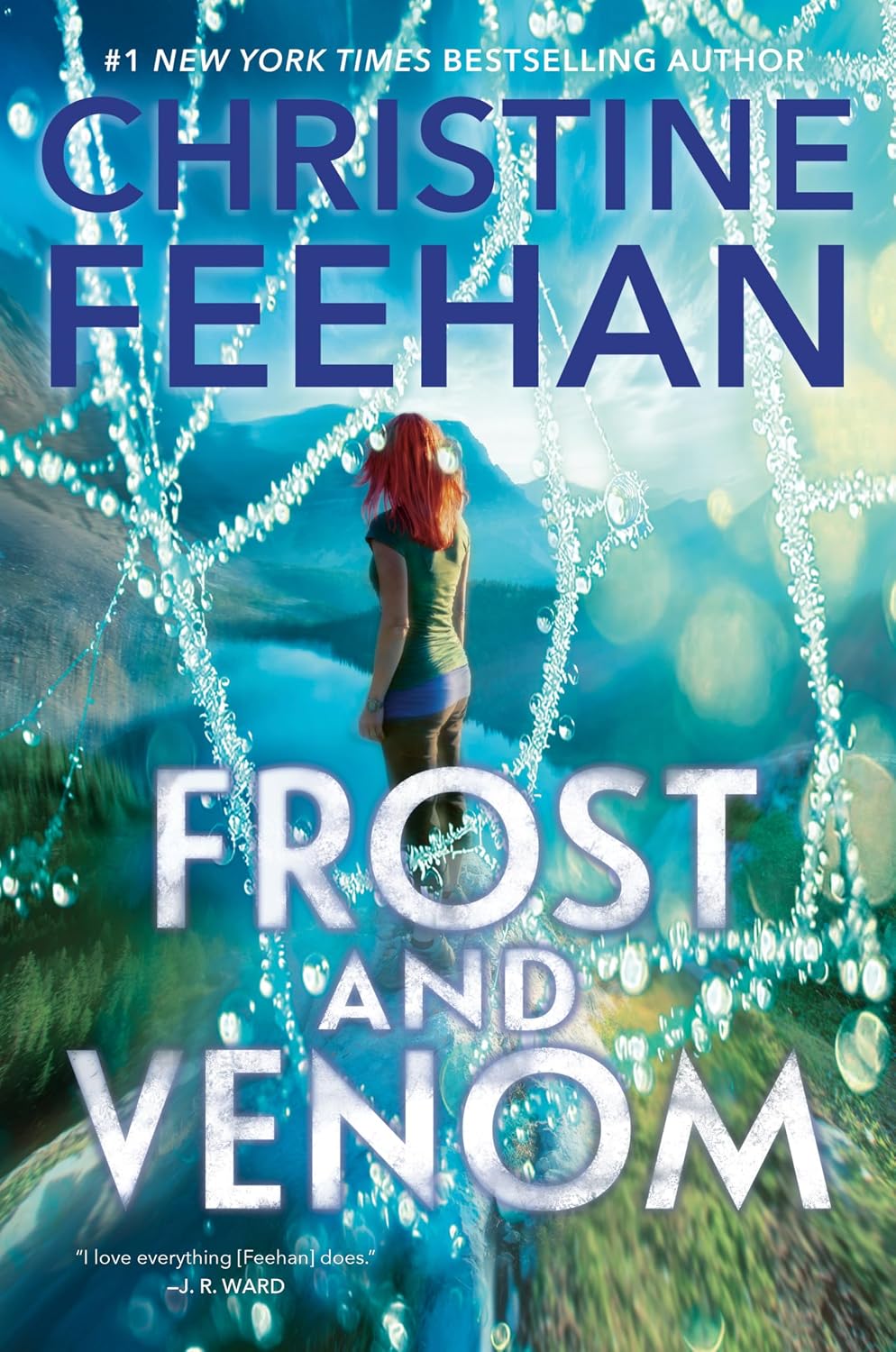 Book cover of Frost and Venom by Christine Feehan, showing a red-haired woman beside a turquoise mountain lake framed by shimmering branches.